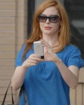 Rose McGowan using her iPhone. Probably not playing Wolfenstein.