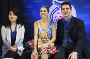 Czisny waits for her scores with coaches Sato and Dungjen during the women's competition at the U.S. Figure Skating Championships in Greensboro