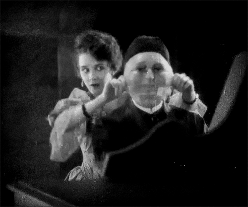 Gif taken from Phantom of the Opera (1925): Mary Philbin pulls of Lon Chaney's mask.