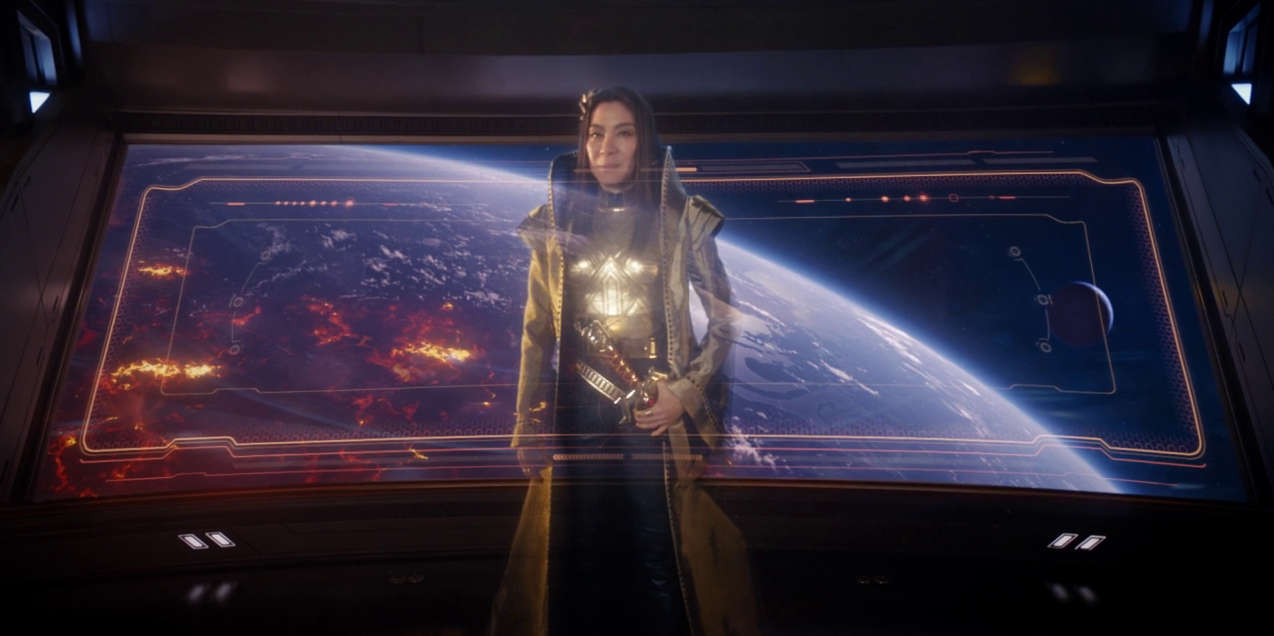 Michelle Yeoh as mirror-verse Philippa Georgiou looking fabulous in a kind of glam-gold disco kung-fu swordsman outfit.