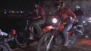 Daniel in "The Karate Kid" is harassed on his bike by members of the Cobra Kai.